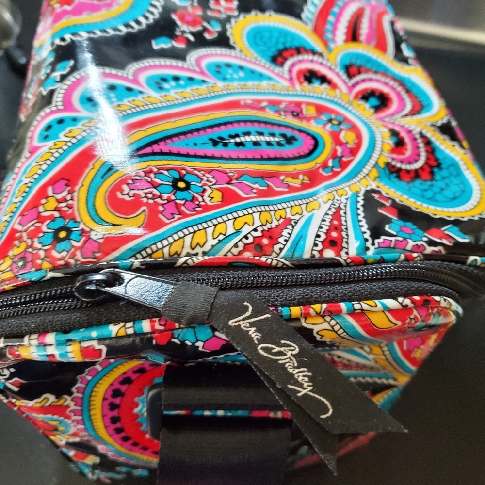 Insulated lunch box with shoulder strap. Measures 7.5in. Ht x 9 in. Long x 5 in